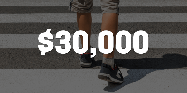 Young adult crossing crosswalk awarded $30,000