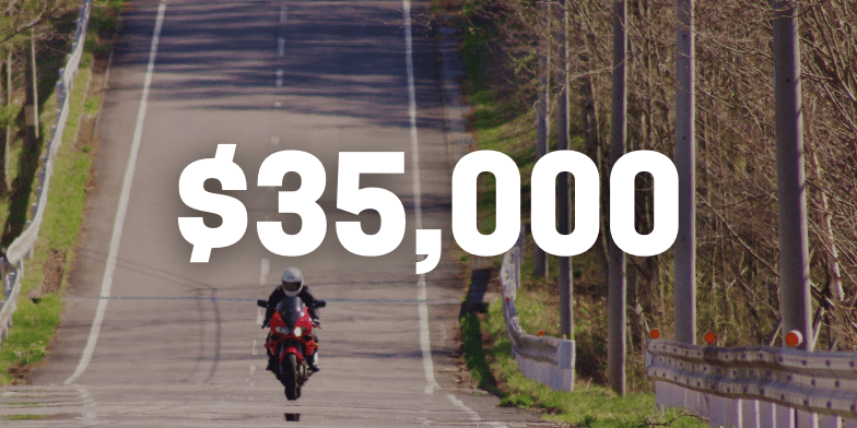 Motorcycle riding down country road