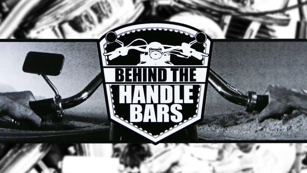 Behind the handlebars